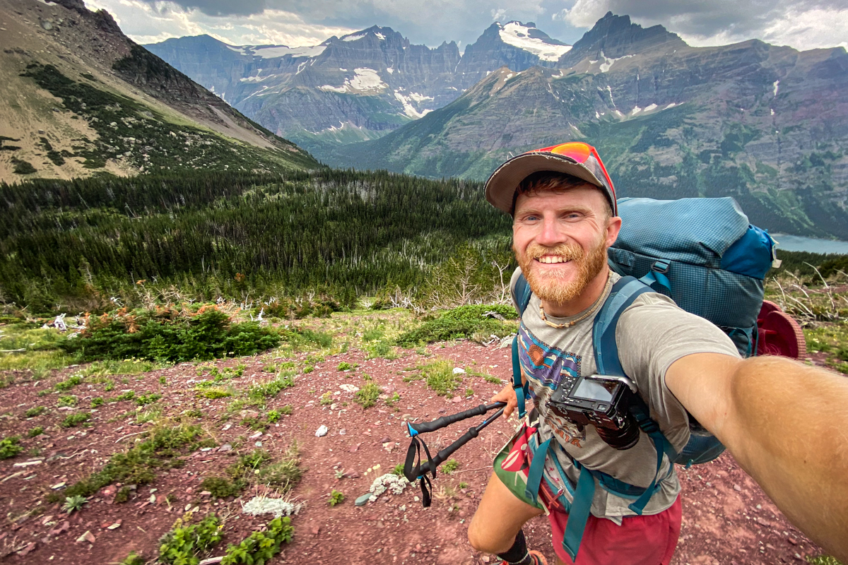 A man backpacking with a Sony camera