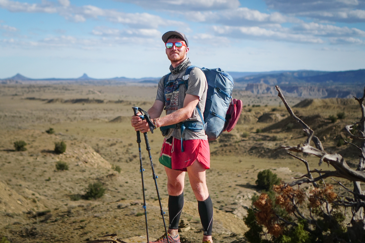 A hiker posing in the desert of New Mexico.